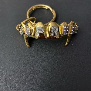 Supreme gold fangs keychain